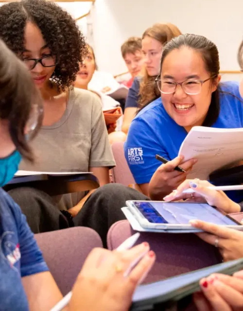 Victoria Zambrano ’27 (clockwise from bottom left), JaKayla C. Harris ’27, Ida Chen ’27, and Kodi Kim ’27 working together during “Introductory Electromagnetism Physics.”  Niles Singer/Harvard Staff Photographer