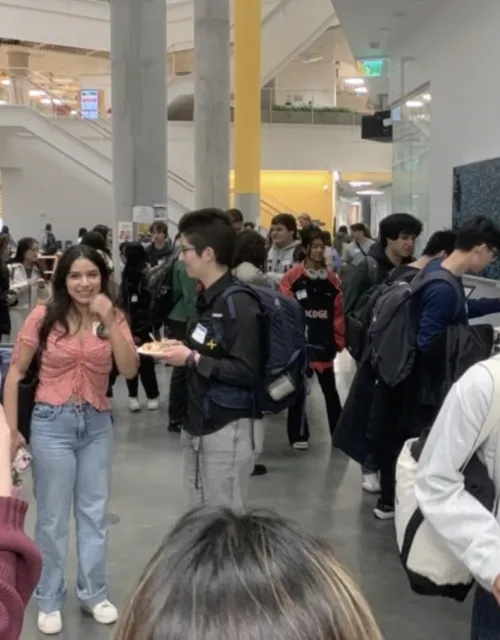 Students congregate inside meeting hall 