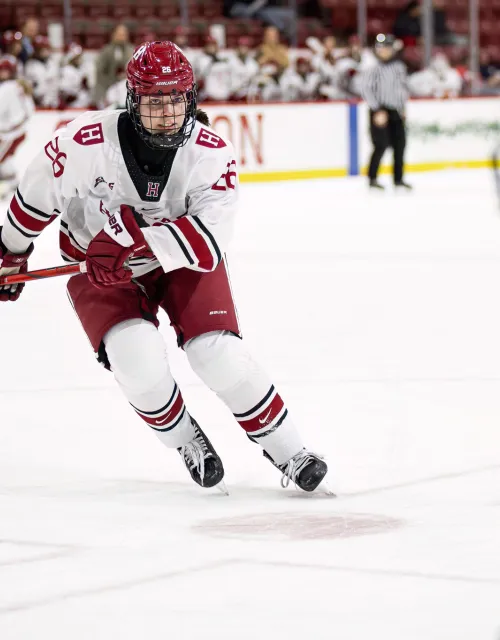 Gabi Davidson Adams in Hockey Gear skating during a hockey game