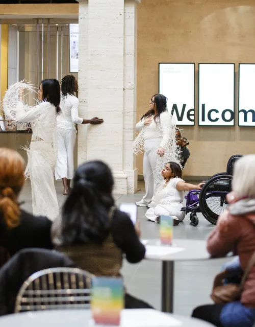 Audience members watch performance inside Harvard Art Museum 
