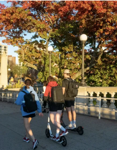Students walk across the Weeks Bridge, which connects Harvard’s Cambridge and Allston campuses.