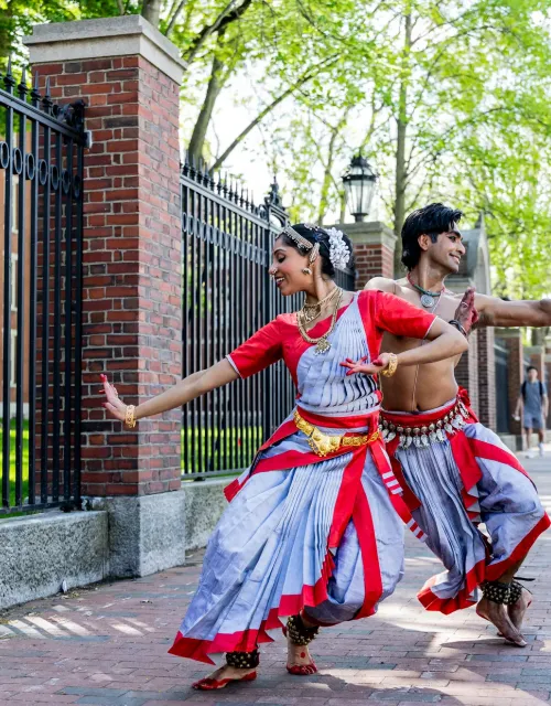Anugraha Raman ’12 (left) and Kohal Das warm up for their performance on Science Center Plaza.