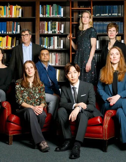 Dean Sean Kelly (second from left) pictured here with professors who will be teaching introductory arts and humanities courses in the fall and spring. They include Lauren Kaminsky (from left), Raquel Vega-Durán, Neel Mukherjee, Spencer Lee-Lenfield, Laura van den Berg, Karen Thornber, and Moira Weigel.