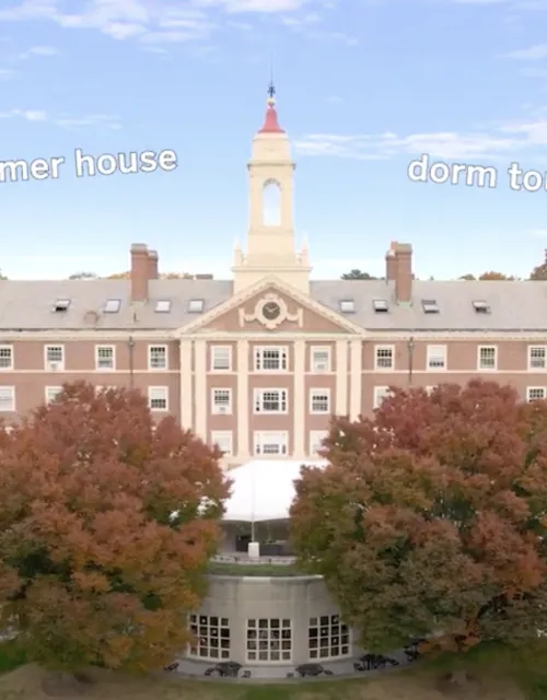Aerial shot of dorm building with fall foliage and trees
