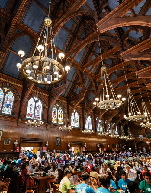 The inside of Annenberg Hall is full of students dining.