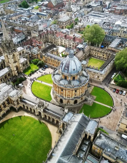 Aerial view of Oxford University, featuring the Radcliffe Camera and surrounding historic buildings.