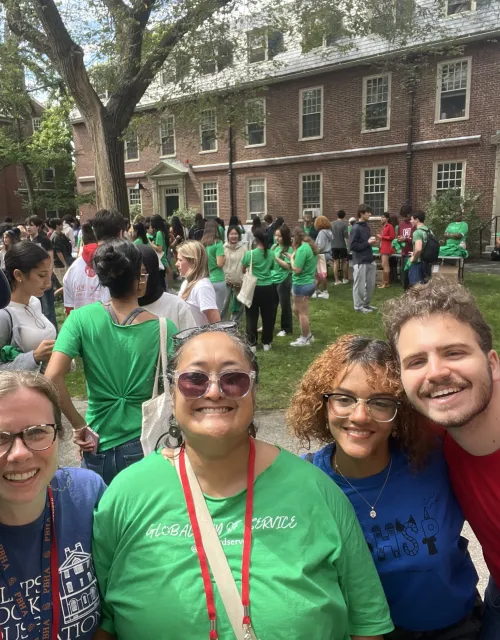 A group of staff and students taking a selfie before the day of service begins.