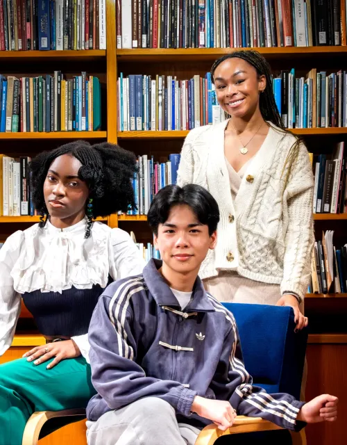 The three student poet laureates (from left to right): Salome, Evan, and Alyssa, inside the Lamont Poetry Room.
