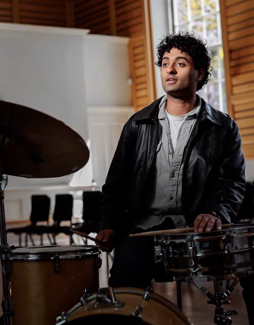 Raghav Mehrotra ’26 sitting at his drumset.