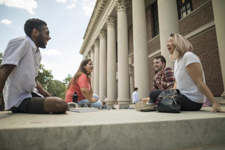 header image - students laughing on the steps of Widener Library