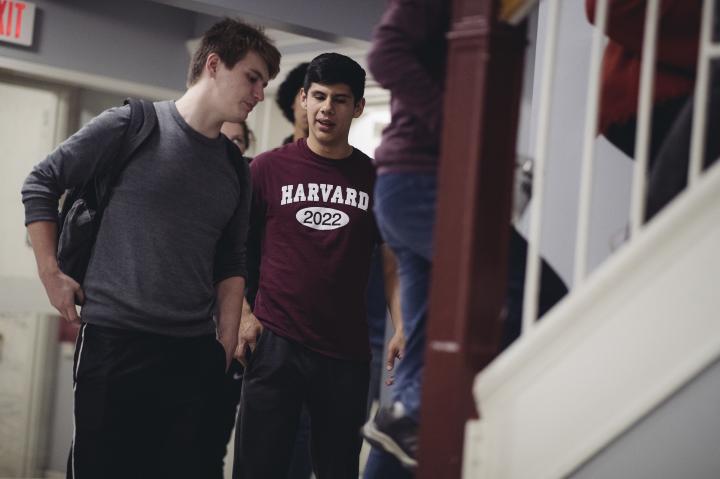 Two students walking up the stairs