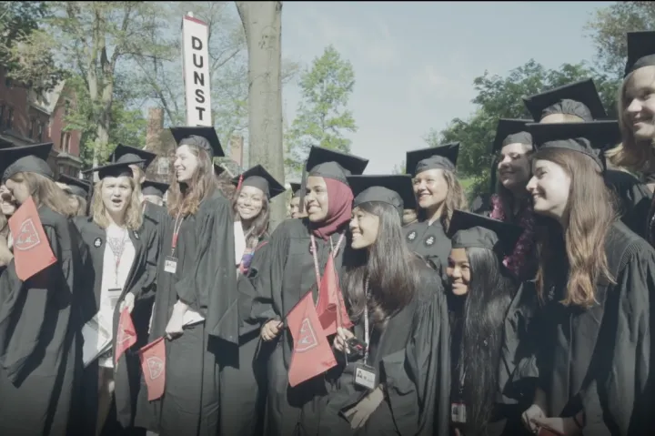 a group of students posing for a picture at graduation