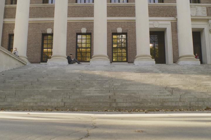Student on the steps of Widener Library