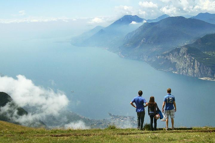 3 students in front of mountains while studying abroad