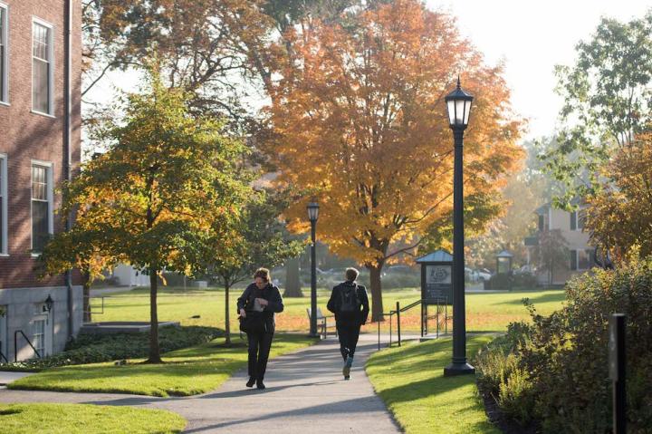 students walking on campus in the fall