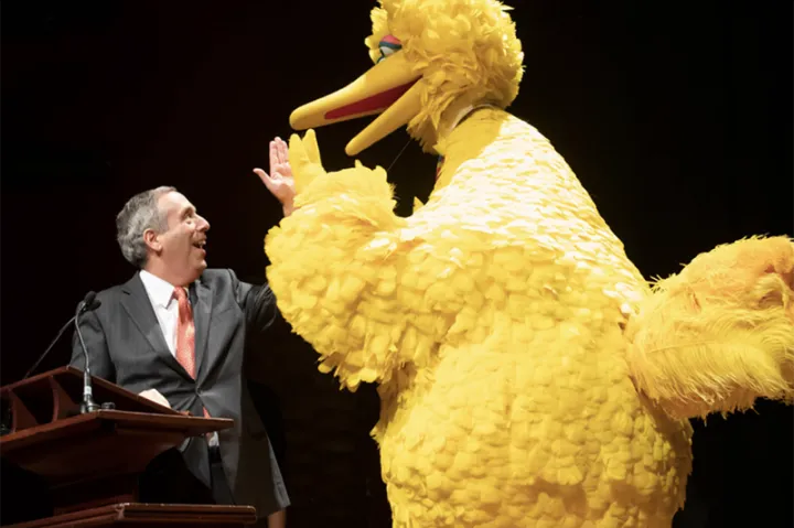 President Larry Bacow and Big Bird
