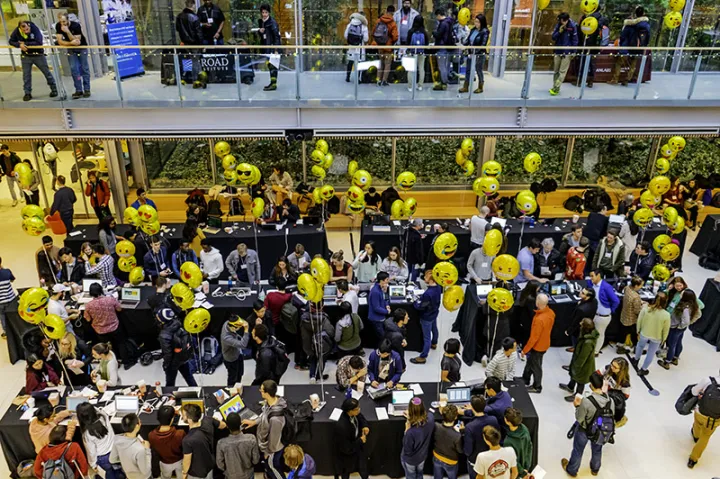 crowd of students in the Smith Campus Center walking around during the CS50 fair