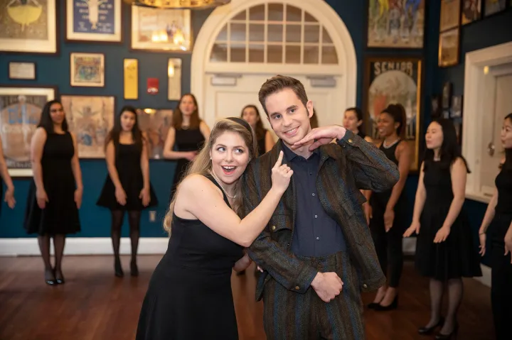 Ben Platt (right) is entertained by Sydney McDonald '21 and the Radcliffe Pitches.
