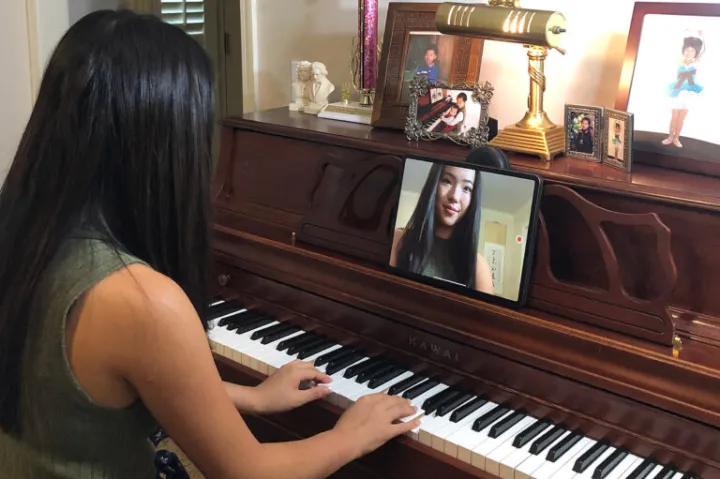 Lucy Tu recording a piano piece for her students.