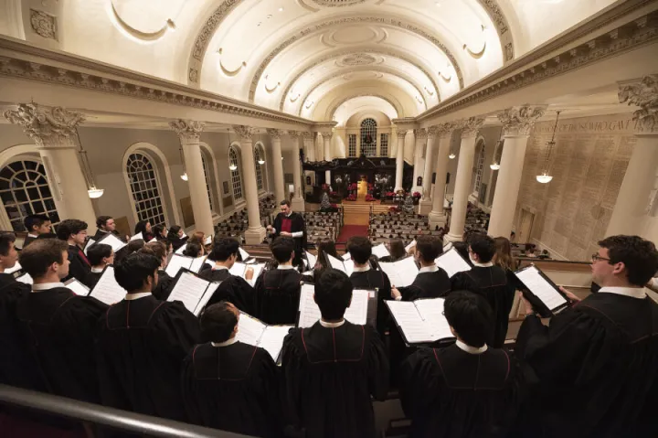 The choir performs at Harvard Memorial Church during a prior year's service.