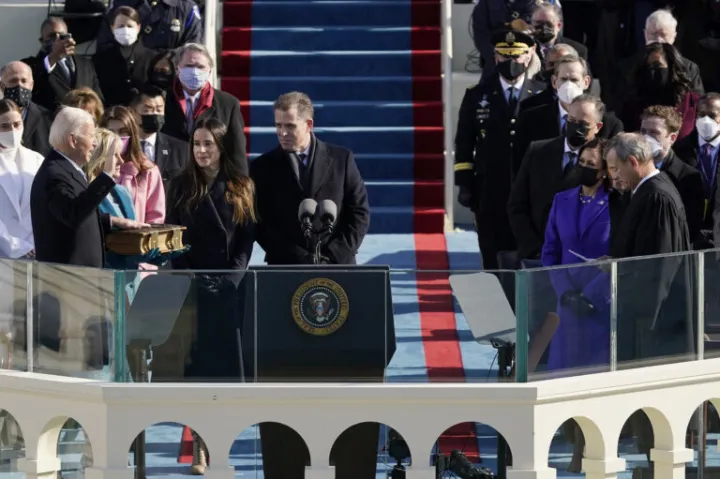 Joe Biden is sworn in as the 46th president of the United States by Chief Justice John Roberts (far right).
