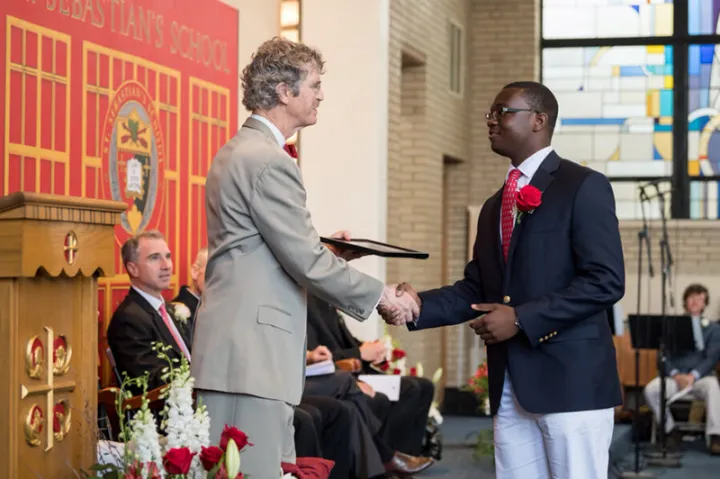 Orvin Pierre ’22 shown receiving and award