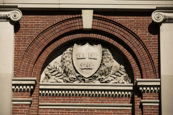 The Veritas emblem in a Harvard archway.