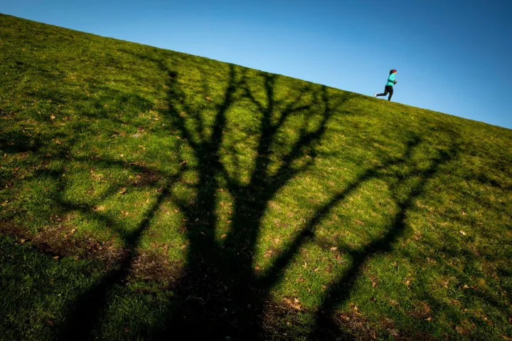 A photo of a runner jogging.