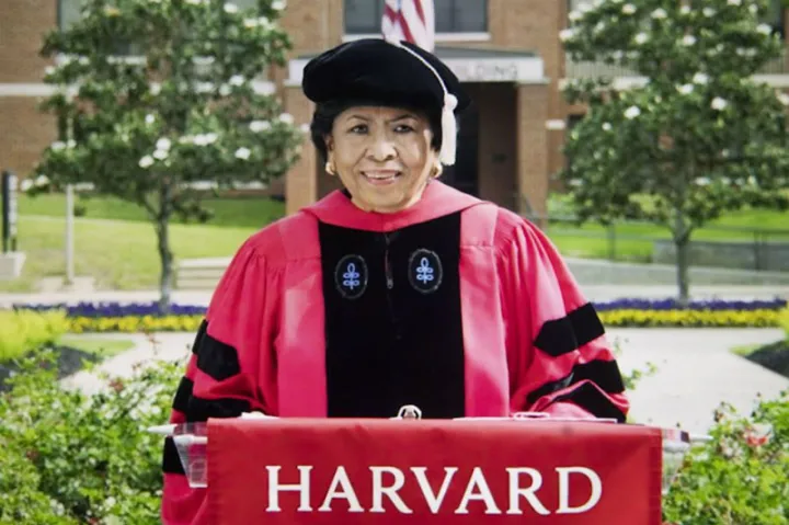 Ruth Simmons in  Harvard Graduation Regalia  at a podium during her Graduation speech to the class of 2021