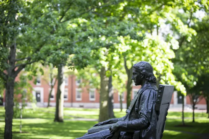 John Harvard watching over Harvard yard