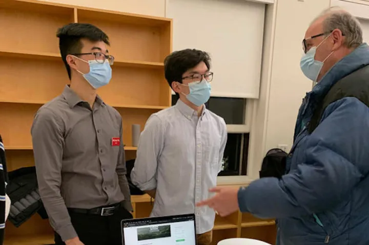 Michael Wu (left), '22, and Benjamin Chang, '24, present Rem, a peer-to-peer fundraising app.
