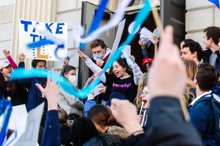 students in Harvard Yard on Housing day