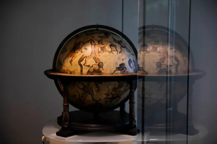 Mercator celestial globe from mid-1500s resides in the Pusey Library hallway gallery, outside the Map Collection, along with its terrestrial companion.