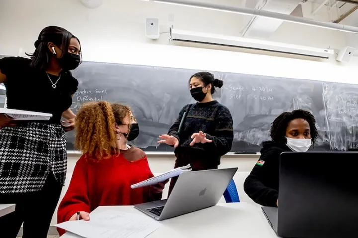 First-years Joanna Walters (from left) and Raquel Reis seek help on Psets, or problem sets, from course assistants Jocelyn Wang and Ivy Tirok.