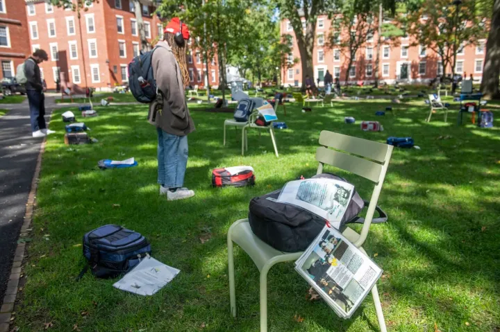 Many of the backpacks on display in the Yard were paired with the stories of the students who carried them.
