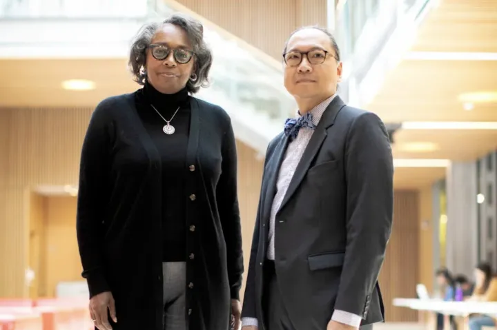 Robin Glover standing with Giang T. Nguyen