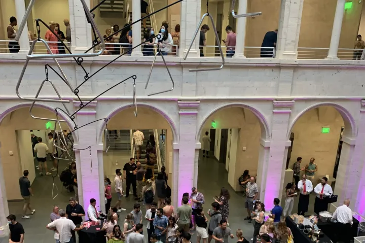 Museum visitors enjoying Harvard Art Museums at Night in the Calderwood Courtyard.