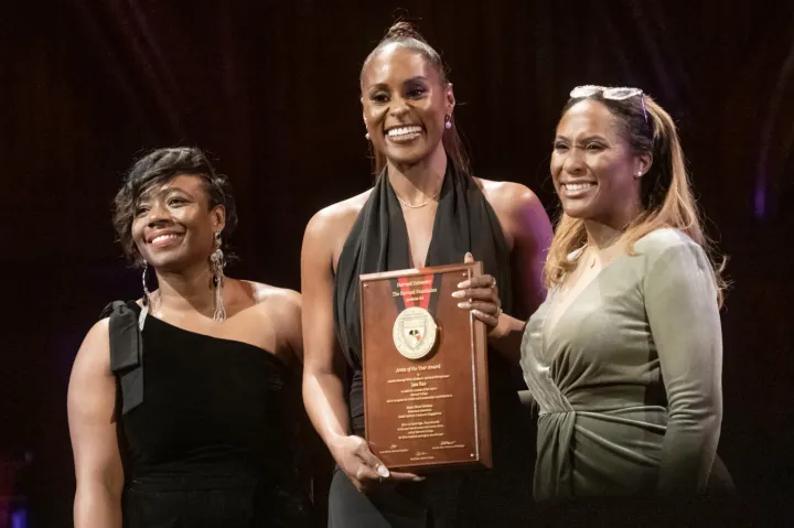 Artist of the Year Issa Rae (center) with Alta Mauro, associate dean of students for inclusion and belonging (left), and Sade Abraham, senior director of the Harvard Foundation for Intercultural and Race Relations.