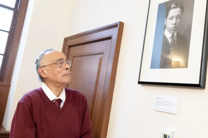 Spencer Jourdain gazes at the tribute to his father, Edwin Bush Jourdain Jr., after its recent reveal in Winthrop House