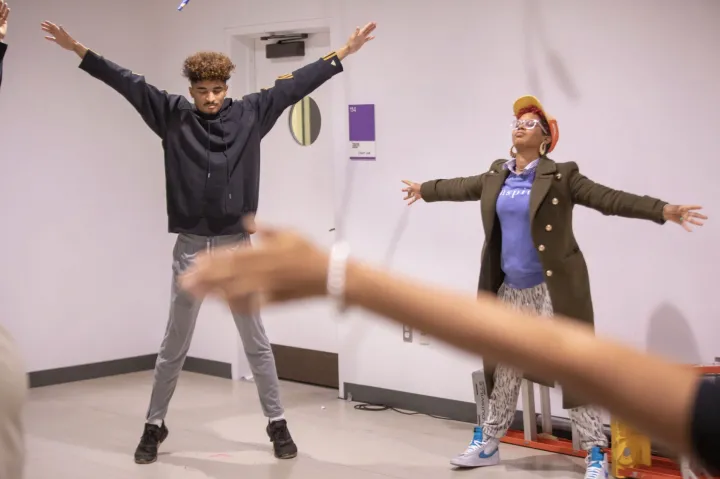 Students and teachers stretching in class