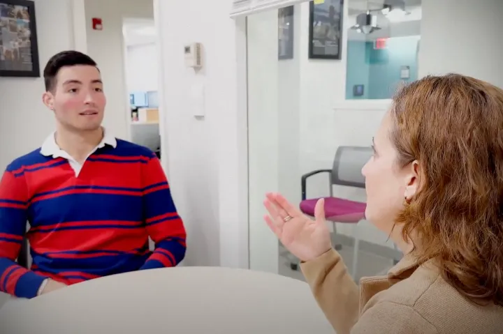 Ben Sorkin '20 having a travel conversation with staff member Nicole Garcia of the Office of International Education.
