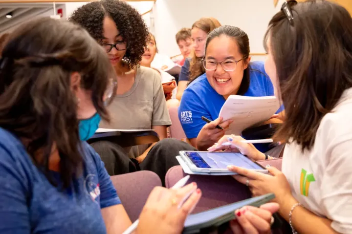 Victoria Zambrano ’27 (clockwise from bottom left), JaKayla C. Harris ’27, Ida Chen ’27, and Kodi Kim ’27 working together during “Introductory Electromagnetism Physics.” Niles Singer/Harvard Staff Photographer