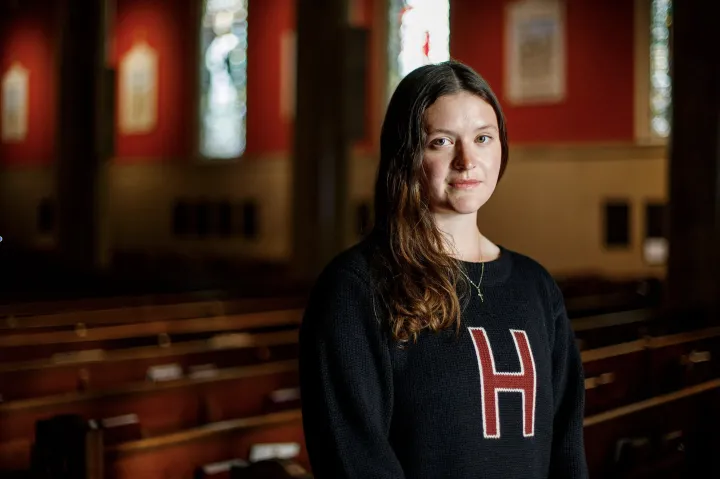 Faith Schmidt ’25 inside St. Paul’s Parish in Harvard Square.