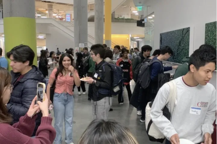 Students congregate inside meeting hall