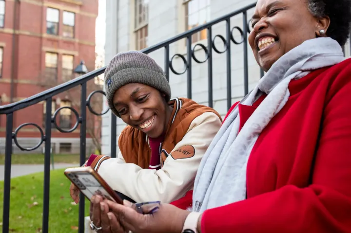 First-year Emmanuel Muriuki (left) and Sheila Thimba, dean of administration and finance.