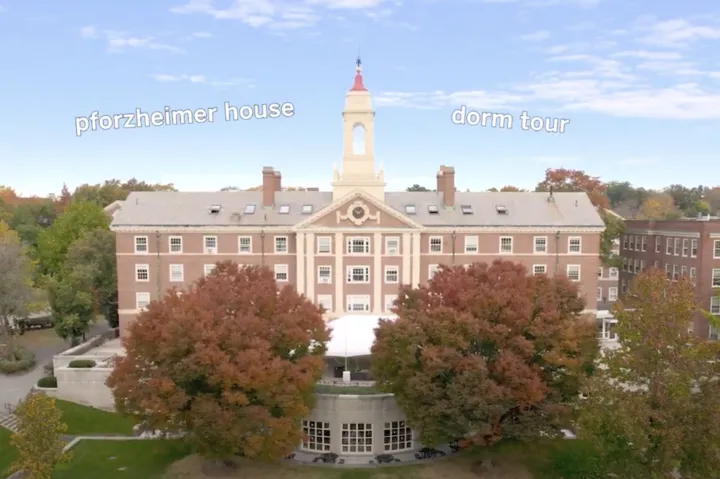 Aerial shot of dorm building with fall foliage and trees