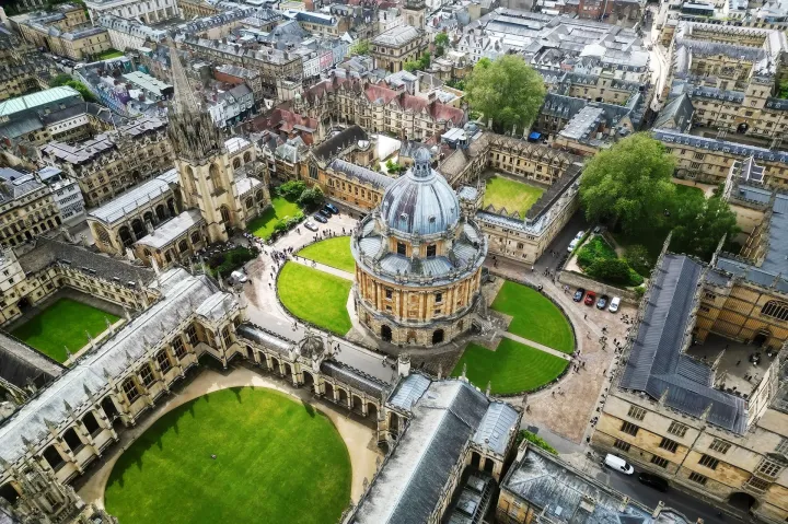 Aerial view of Oxford University, featuring the Radcliffe Camera and surrounding historic buildings.