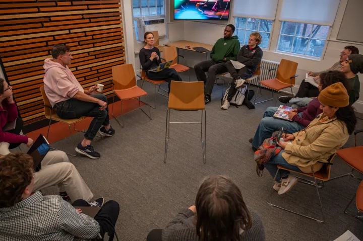 A group of students sitting in a circle during an Arts Wintersession program.