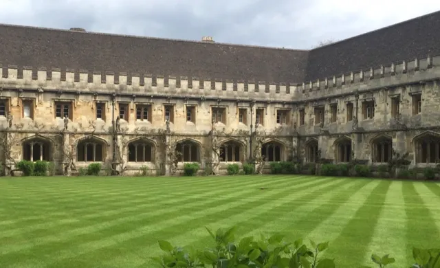 Manicured lawn in front of an old building