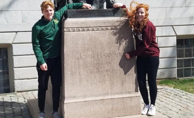 Allison and her brother with the John harvard statue